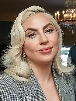 Lady Gaga glancing towards a camera