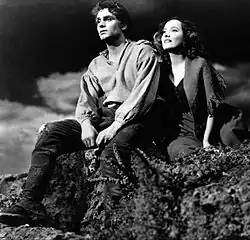 studio still of young man and woman in outdoor setting